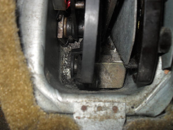 broken part in shifter cavity! I don't know how to point to it but its the square looking piece at the far back and bottom of the shifter cavity. The neutral switch is on the right...black in color. The broken piece is sort of grey.