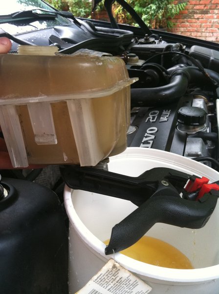 I tried clamping it at first, but it wouldn't shut off flow.  So it holds itself over the bucket! I'm an accidental genius =)