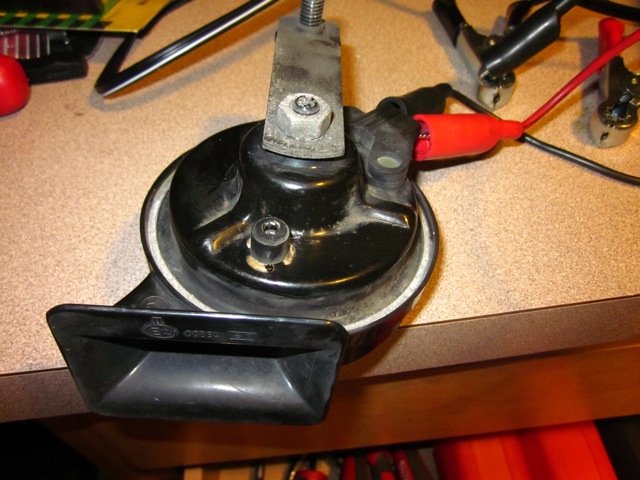 Horn after removal from car.  Cap is covering the torx 20 screw.