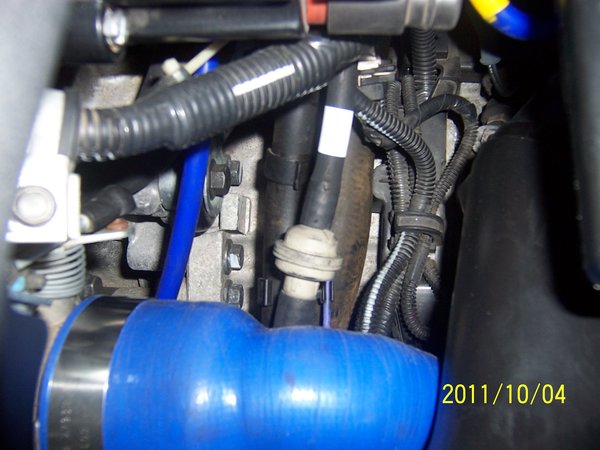 Volvo Part # 97 T259  (round plastic) and hose in white tape