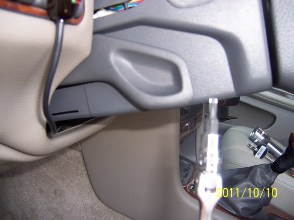 Locate and remove steering column cover. Release top cover, remove bottom cover 3-torx screws.