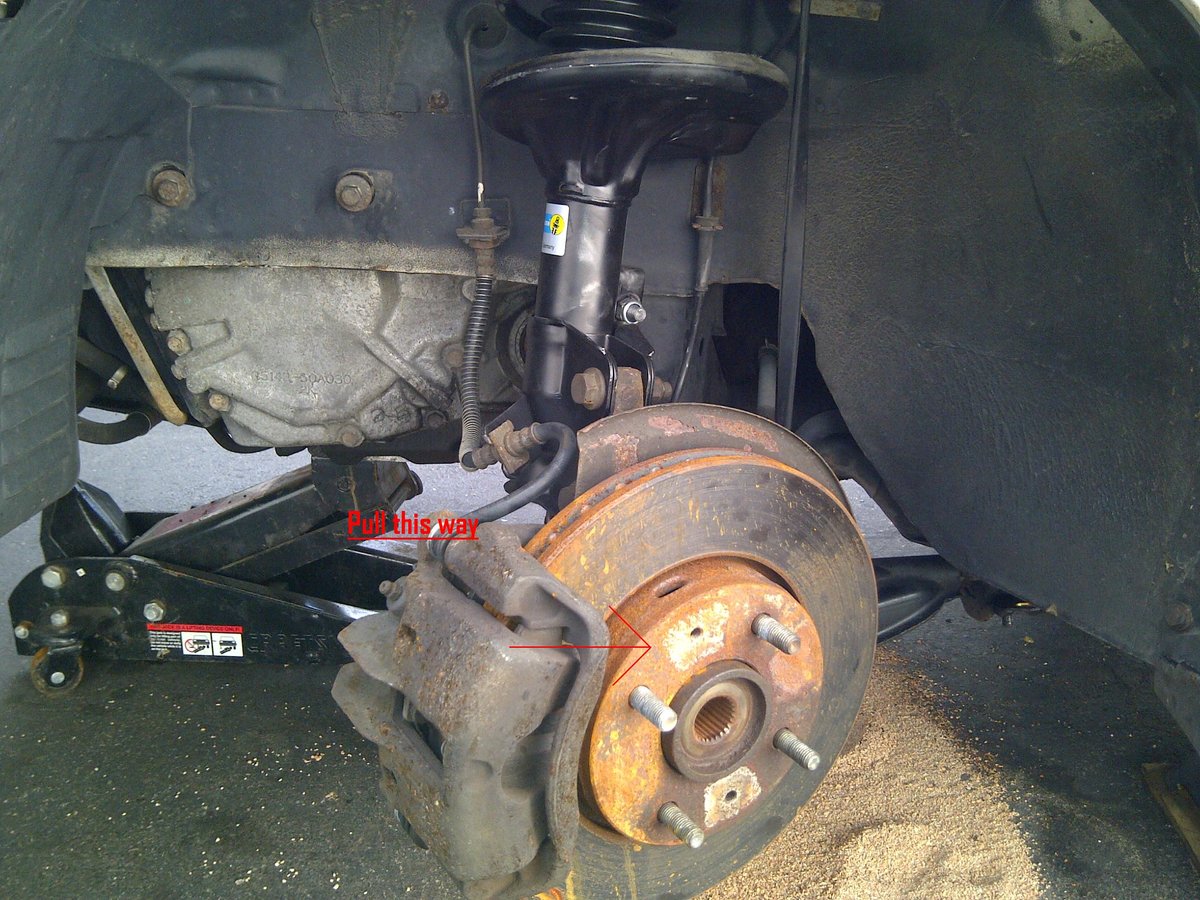 Push rotor toward rear of car and pull CV axle out.