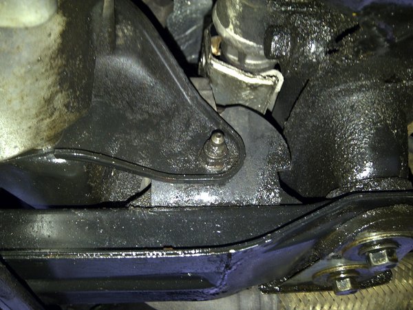 Rear mount. 14mm bolt, 15mm nut. I think.