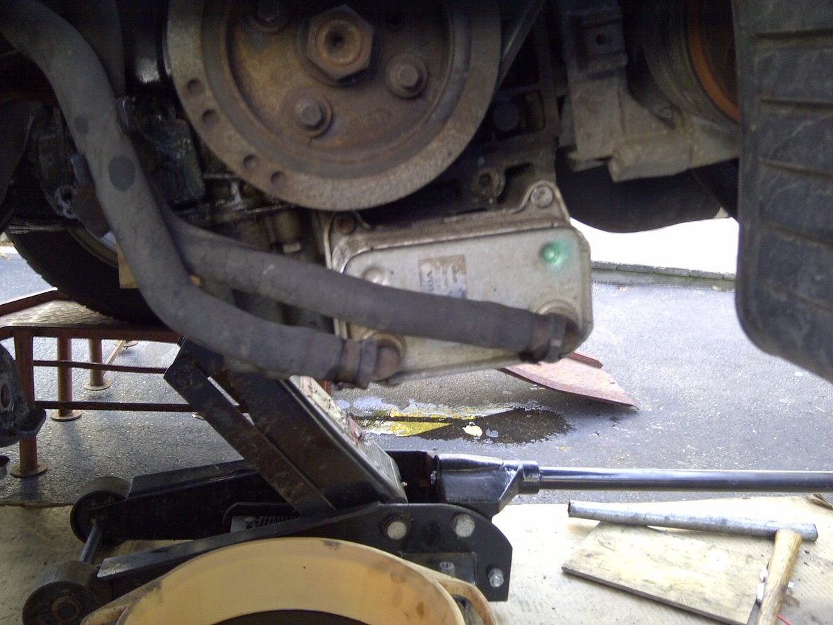 Disconnect two hoses.  Note hose positions.