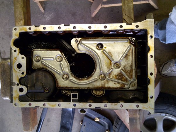 Oil pan degreased and mating surface cleaned.