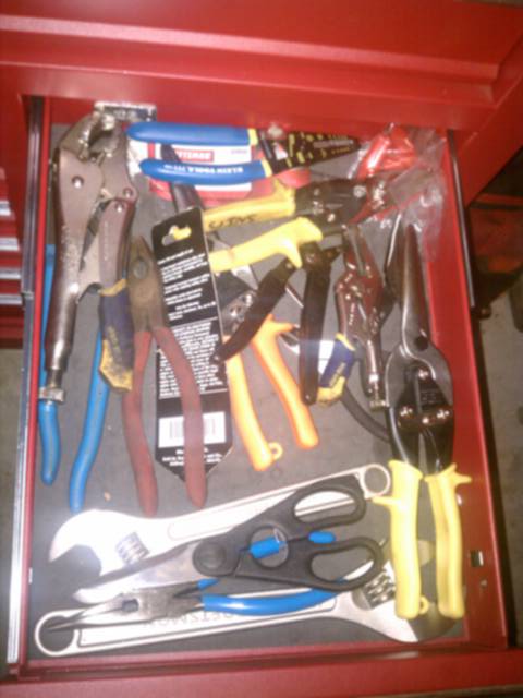 Pliers, vice grips, adjustable wrenches, wire strippers, and snips.