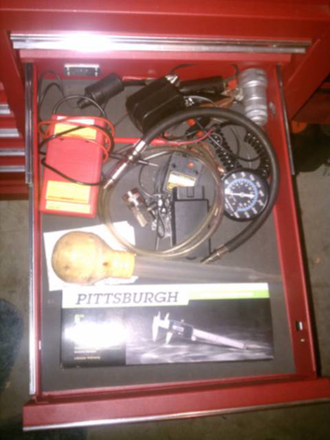 Import drawer. Compression tester, multimeter, calipers, basting tool (for fluid removal), ELM blue tooth adapter (for phone OBD scan tool), battery topper off-er.