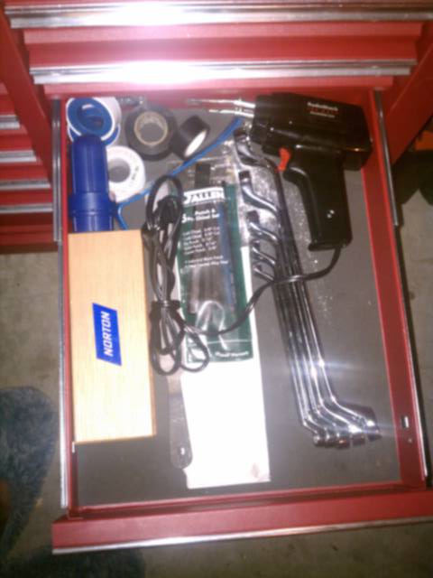 Soldering iron, Norton grinding stone, Allen punches, file, Lisle brand battery terminal cleaner, 1/4"-15/16" double box deep offset wrenches, teflon &amp; electrical tape