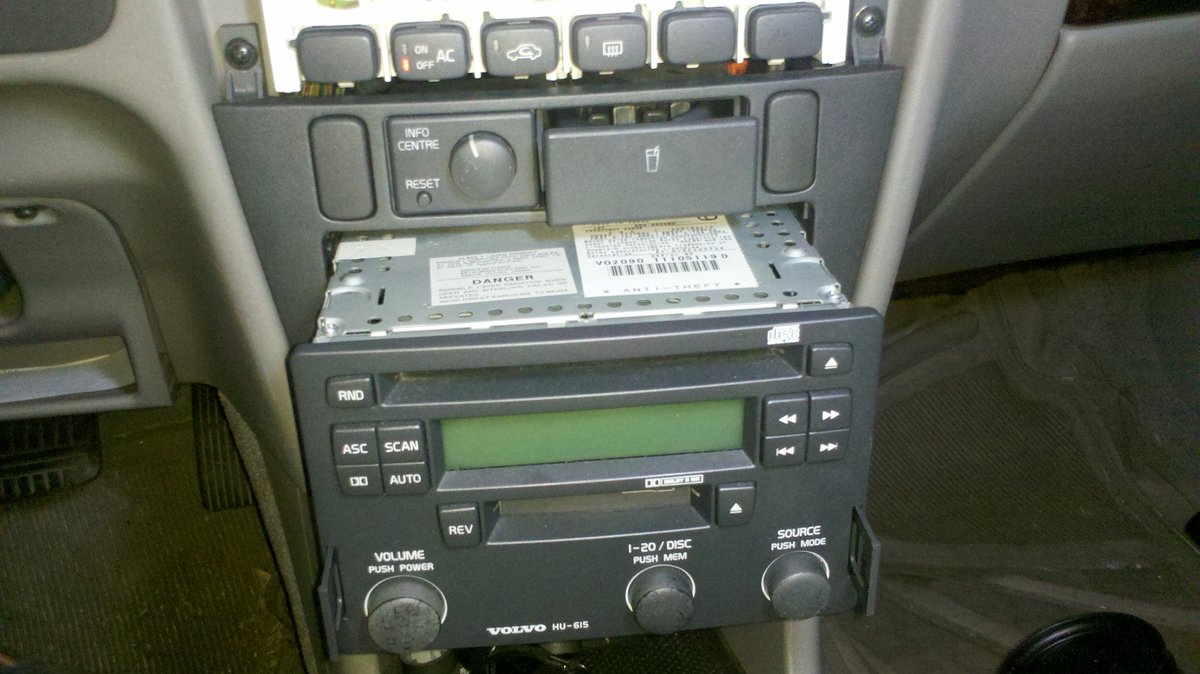 Knobs and faceplate off and pulling radio out.