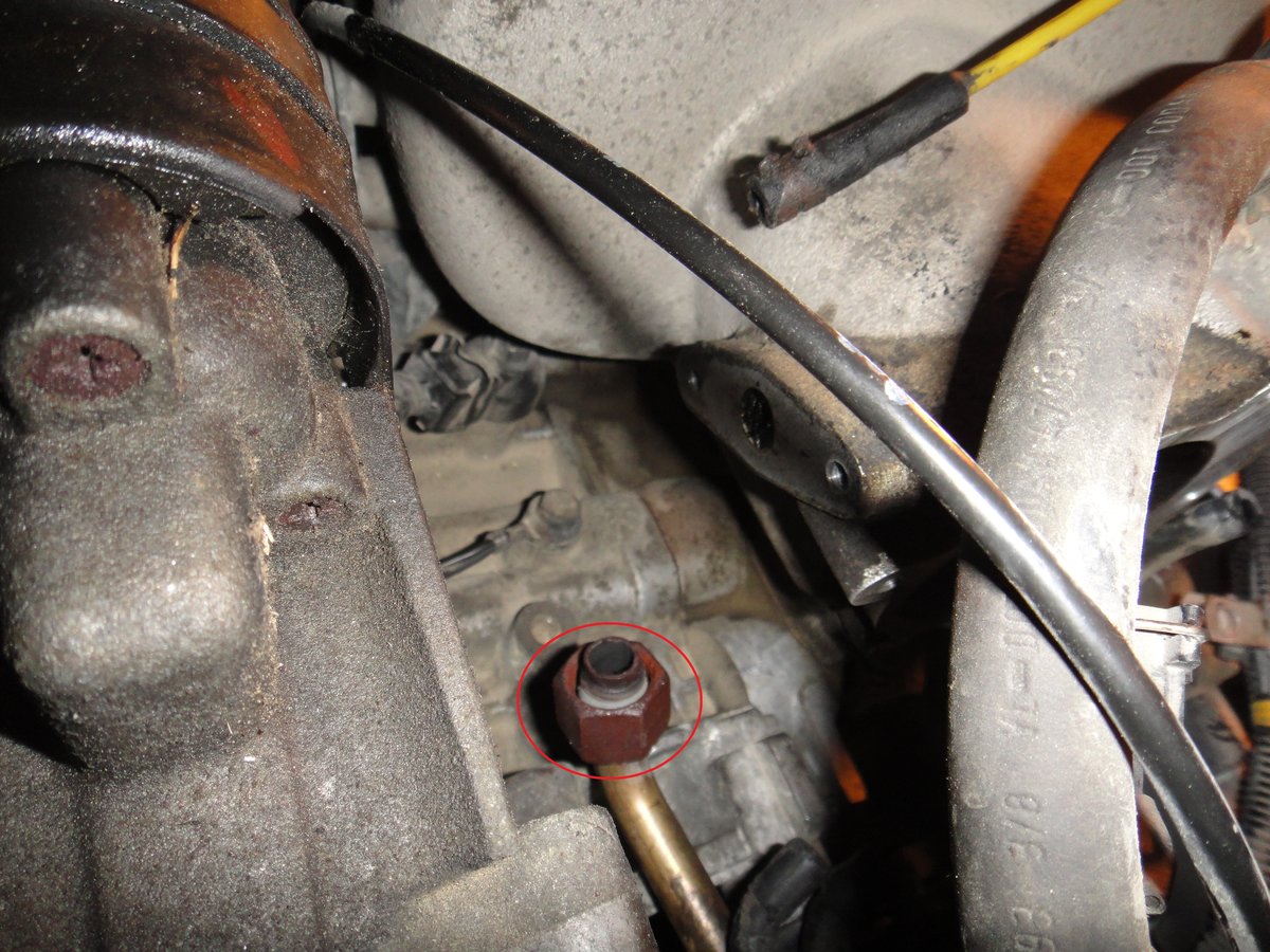 this is the bolt that is on the tail of the EGR if you didnt know, The picture also shows the gap where the EGR sat. Make sure you clean this area off before putting new gaskets on. ALSO clean the hole going down to the EGR, as well as all other connections, that way you aren't re-cleaning 5 years down the road.