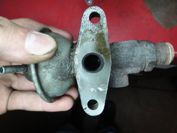 This is the hole you will have to drill out (I used the closest sized bit) and it just kept pouring out.   Also use your cleaner of choice, make sure not to get any one the rubber (valve) parts as its likely your cleaner will destroy them.