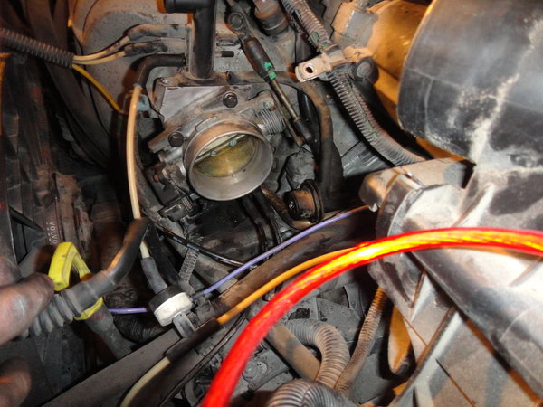 tighten on the throttle body, 14lbs/ft or 168lbs/in don't forget to re-attach the EGR lines, and the sensor. <br />once the Throttle Body is on, attach the two lines at the bottom, and the Position sensor. (I didn't mention it earlier) but your most definately going to want to clean these up, and as much of your engine as you can, if you can hold a suction on the EGR it will open allowing you to clean it further.