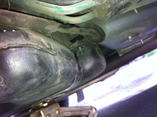 Remove 12mm bolt to allow tank to drop down. I used a scissor jack, however it is not needed.