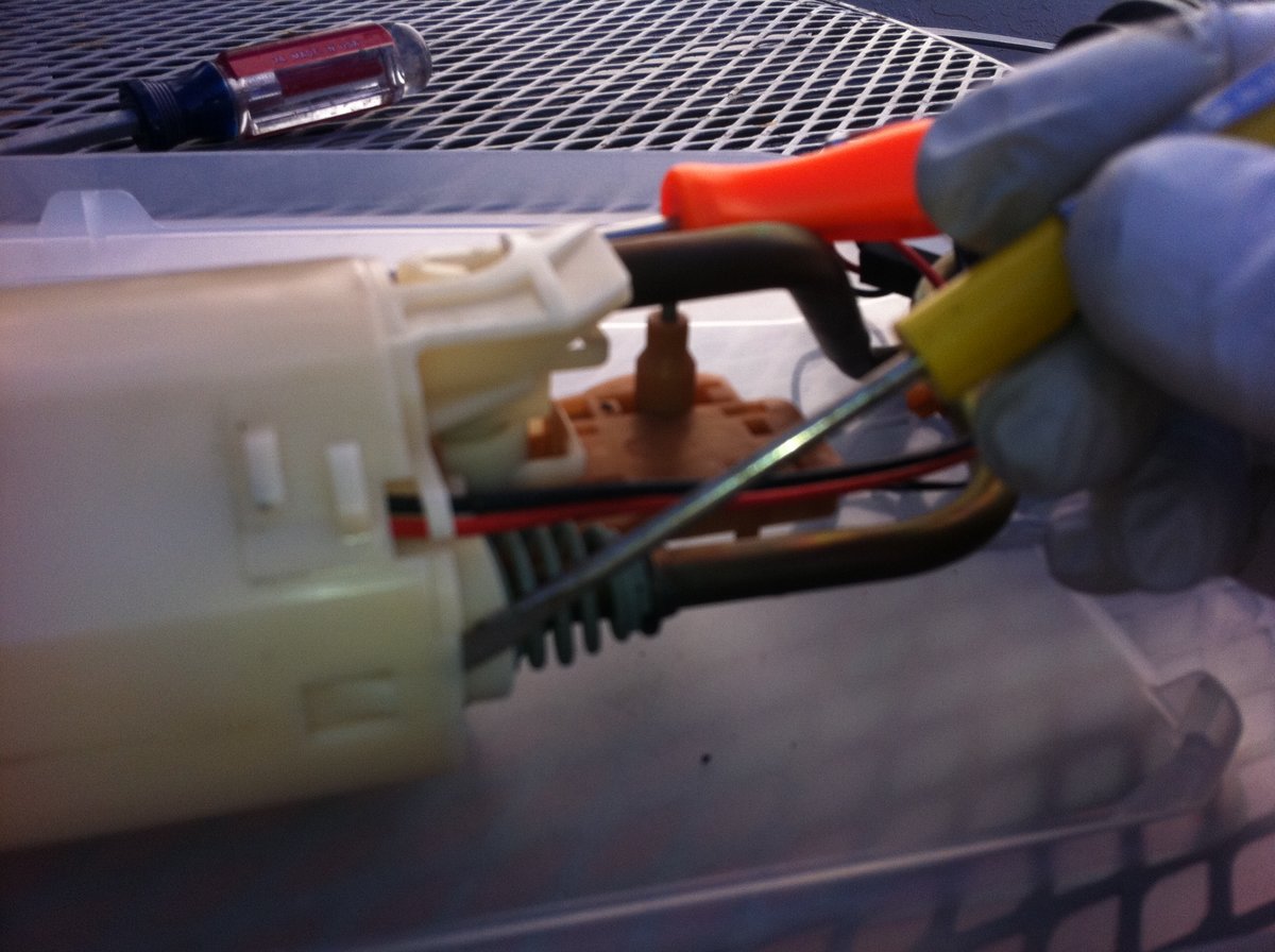 I had to use three screwdrivers at same time to release the tabs. You may need a helping hand.