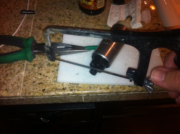 Trimming the pump to match original pump dimensions. Make sure you clean out all the plastic shavings.