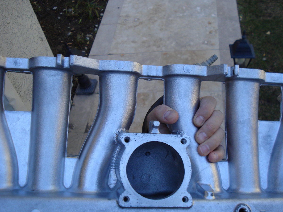 while the intake manifold was removed, i took it to a DIY car wash and covered the entire thing with GUNK GEL degreaser, and then blasted it with hot pressurised wash. not bad huh?