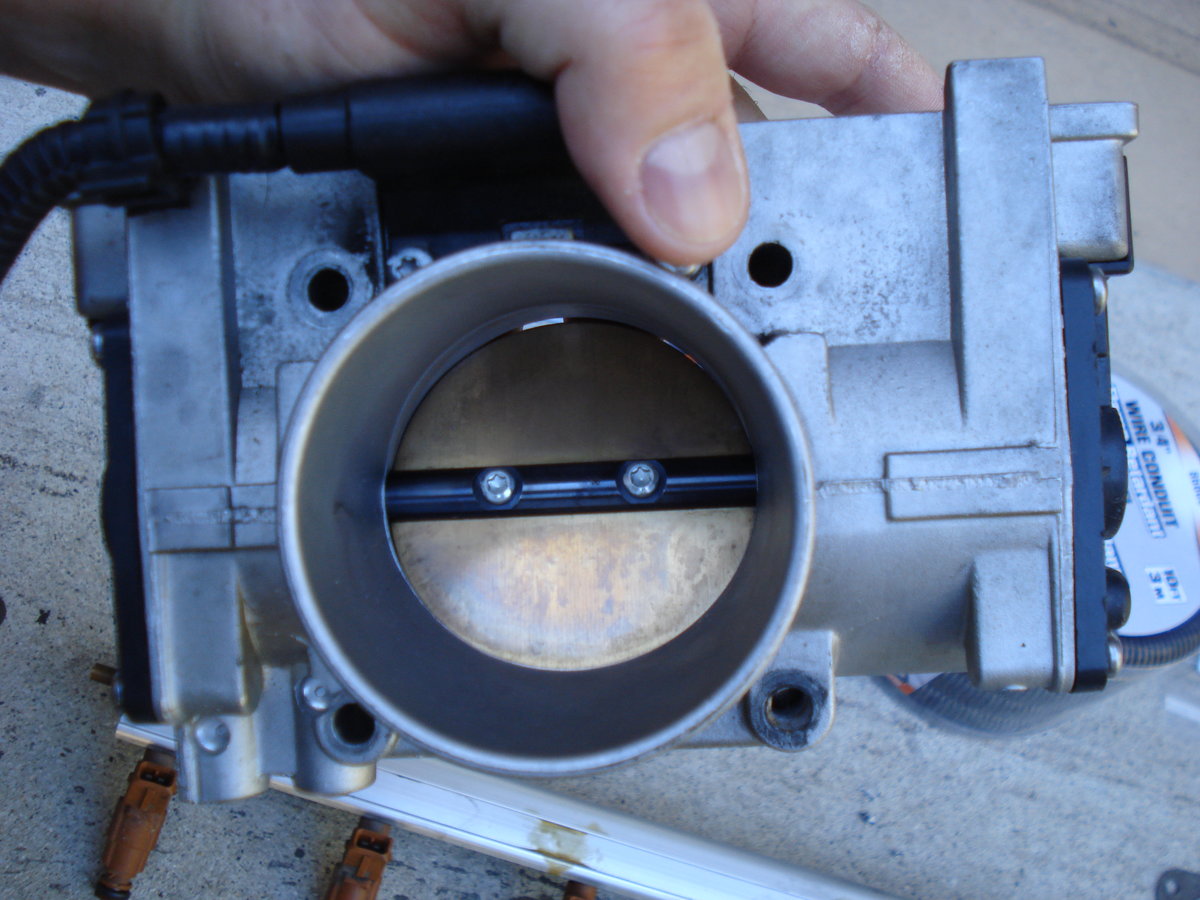 cleaned the ETM while i was at it, didnt really have the common surging problem i have read about..used some shop towels and q tips and good ole' carb cleaner. DO NOT WASH IT.