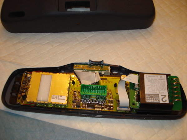 here is the new mirror soldered to the original circuit board , note: if you are using an 05 model mirror, it does not have the double sided tape, instead its a flat plastic housing where it is already attached to the mirror, so all i had to do was solder the wires and attach the mirror to the mirror, it has 6 small locking tabs. 2 small modifications i had to do and i discovered these mod's as i was installing the unit into the rear view casing:<br />1 there are two studs which go through the two holes in the circuit board, i couldnt close the casing, and had a hard time figuring out what was blocking the instalation, so i simply cut it with wire cutters (the 2 studs are soft plastic). and you dont have to worry about the mirror moving, becasue at this point they are locked in to the plastic housing which is connected to the mirror. on the 99 and up , you would have to perfectly align the mirror to the back of the circuit board with markings, as previously explained by a fellow Volvo enthusiast ( i forget his name) on the S80 forum.