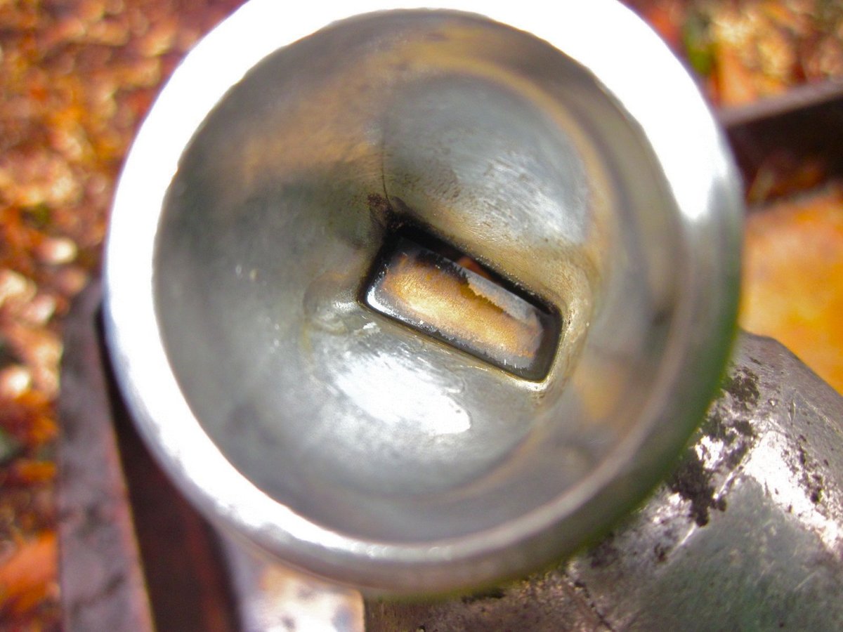 IAC valve with ~15 years build up of varnish (pre-cleaning)