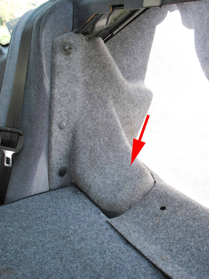 ...back seat is folded down, looking inside the trunk, I believe, rear shocks are where arrow points, Yes?