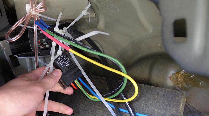 Mess of wires! Inverter mounted with double-sided tape + long zip ties going around it