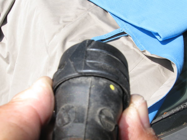 Retaining collar rotated about 1/4" CCW.  This is enough to withdraw the retaining lugs and remove the hose.