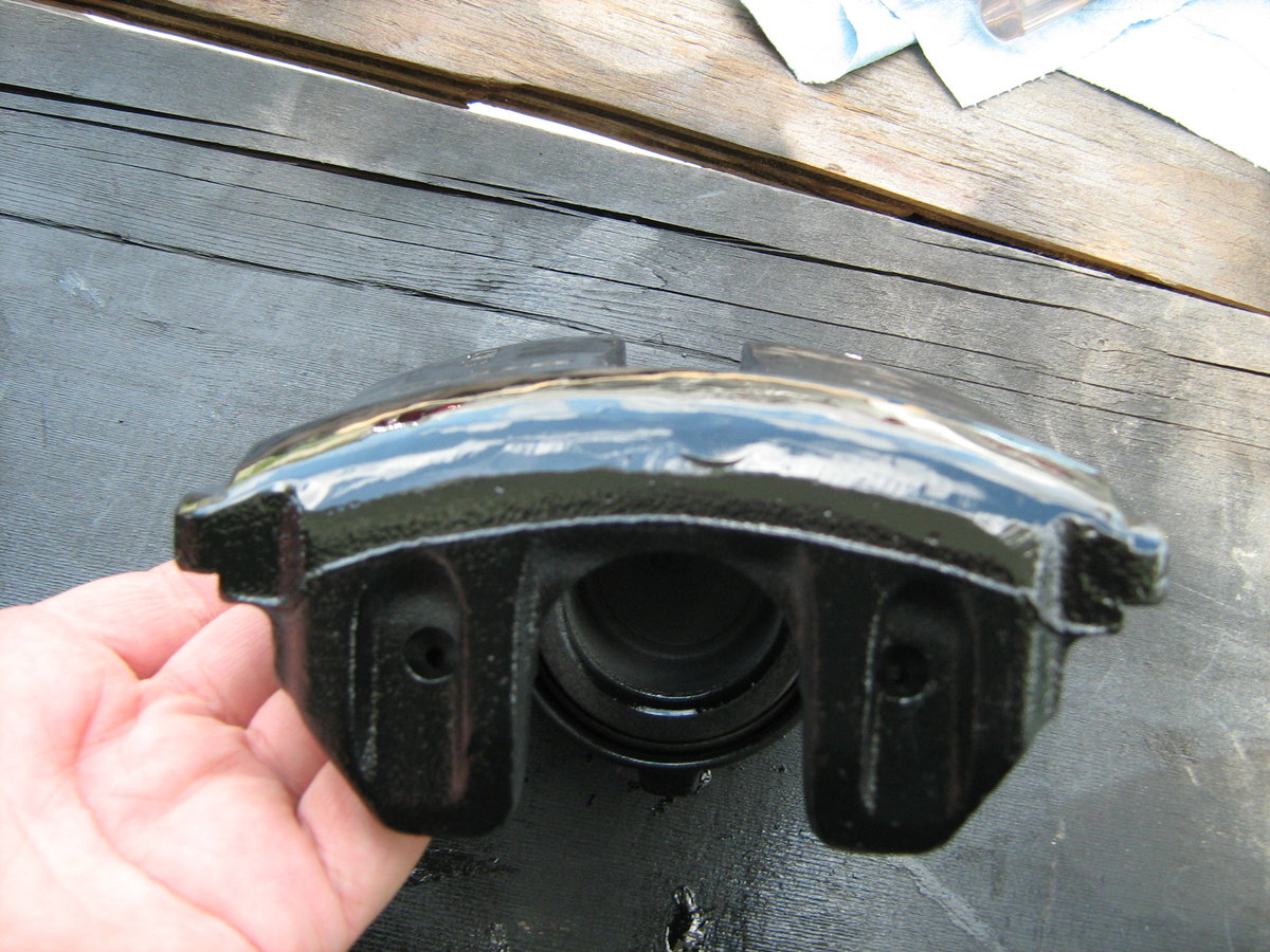 002: The view from the outboard side. Note that the ribs are gone and the curvature is smooth and constant all the way across the caliper.