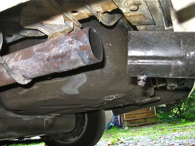 After loosening the 10mm nut to allow the tailpipe to be slid off of exhaust pipe.