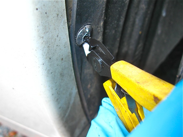 12) Nibbling heads of rivets with pliers.jpg