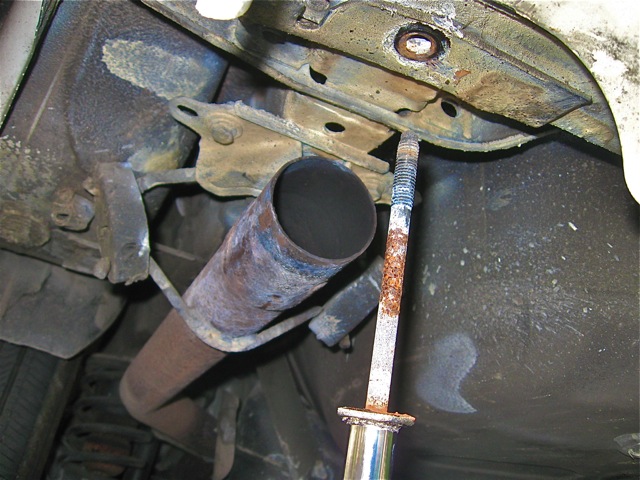 18) Withdrawing pitted bumper bracket bolt on driver's side.jpg