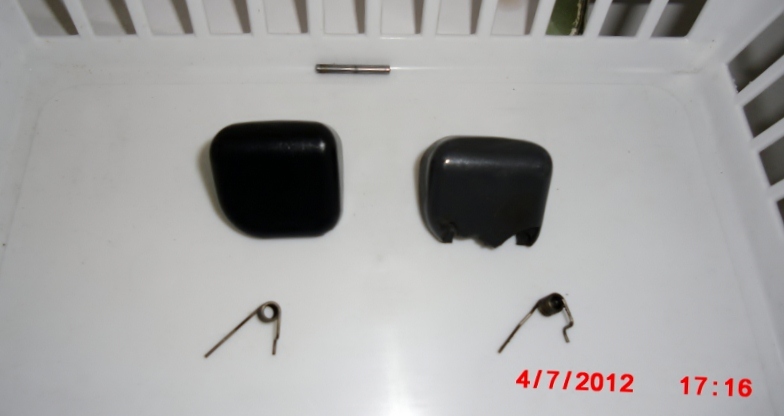 New shift knob button on left, broken on right.