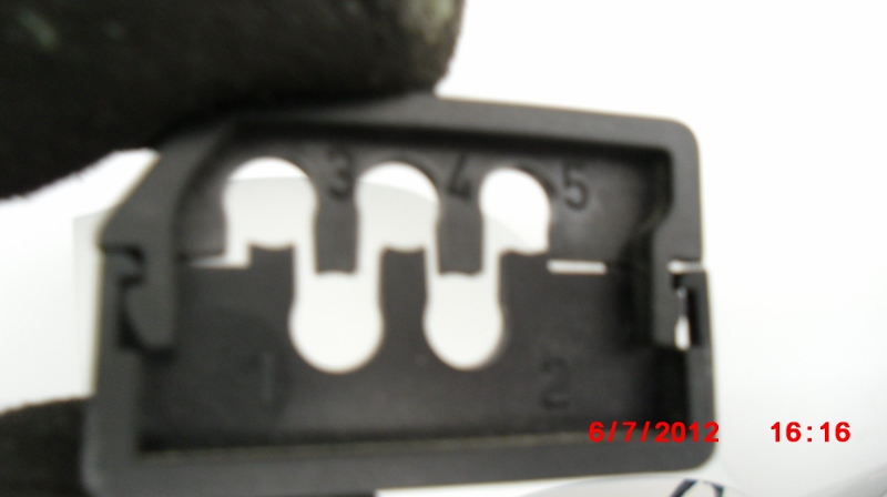 This guide is marked 1-5 to correspond with the spark plug wires and helps keep the wires off the engine block.