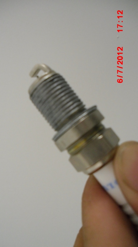 Wipe anti-seize lubricant on threads only. Use a shop towel to wipe lubricant off the electrodes.