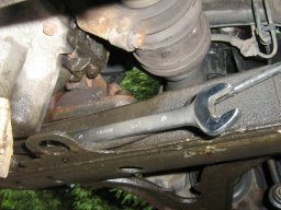 wrench on control arm bolt small.jpg