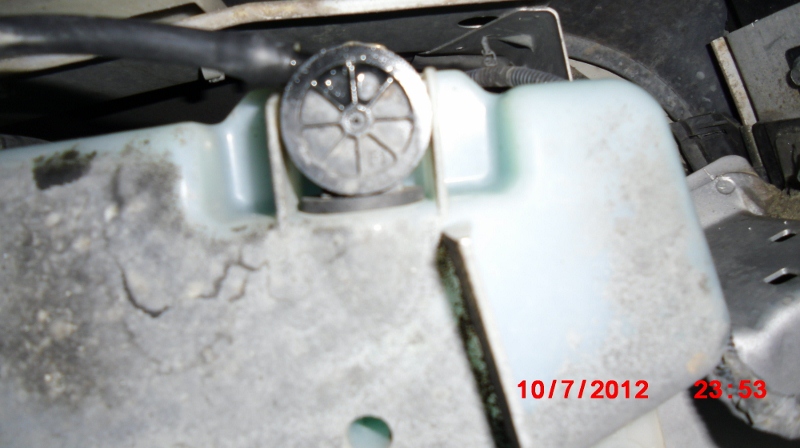 Connect windshield nozzle line directly to the washer fluid tank. Remove the lines for the headlights.