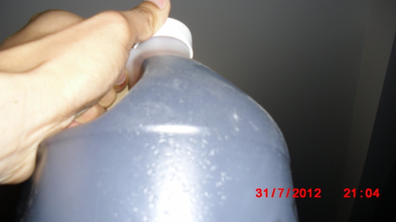 Used Valvoline MaxLife ATF, dark brown with a hint of red.