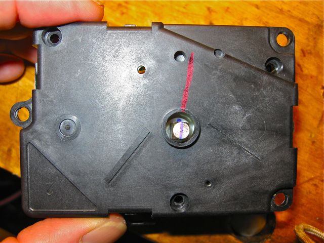 Aligning the clocking mark on the shaft with the cover -- reposition gear if not aligned.jpg