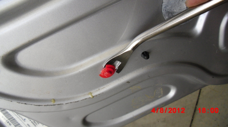 Removing broken interior door trim clips. Some were already broken, some broke while removing the trim.