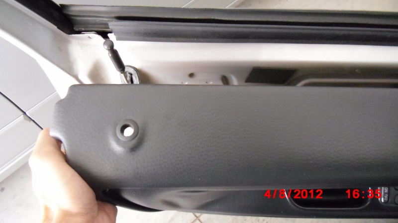 Lifting interior door trim of a 1998 V70 XC over lock pin. Took a bit of force to pull trim off the edge of the window gap.