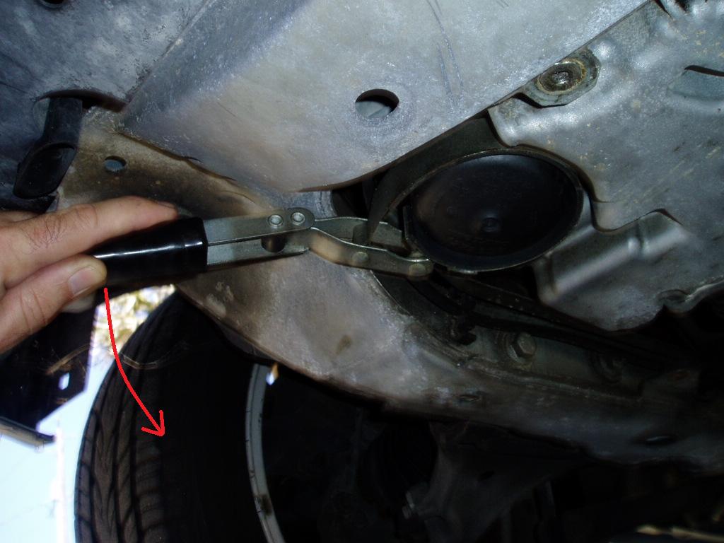 Use the Filter Wrench to Loosen the Cover by Turning it Counterclockwise.jpg