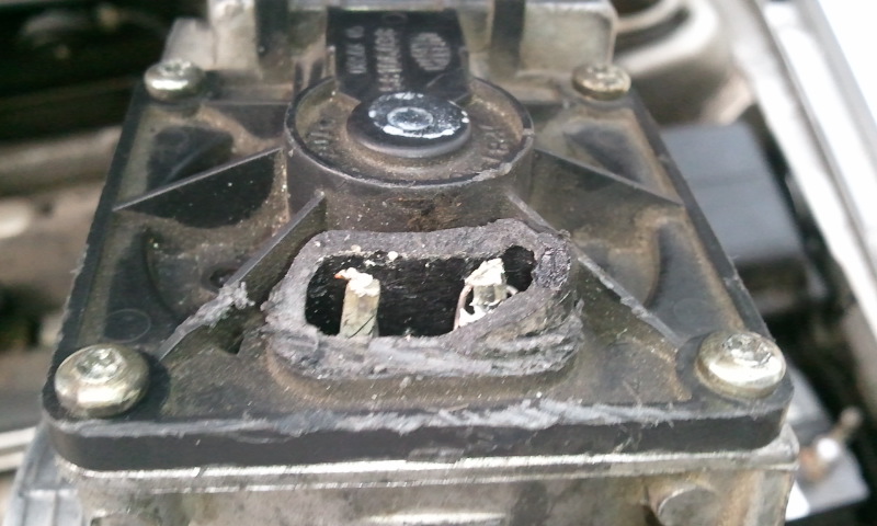 The 5 prong coil side TPS.  The wire on the right broke of initially because I accidentaly took off the wrong tps at first but I broke the cap off and resoldered both.  With the black prong of the mulitmeter on the negative battery terminal to ground, they both read 12v.