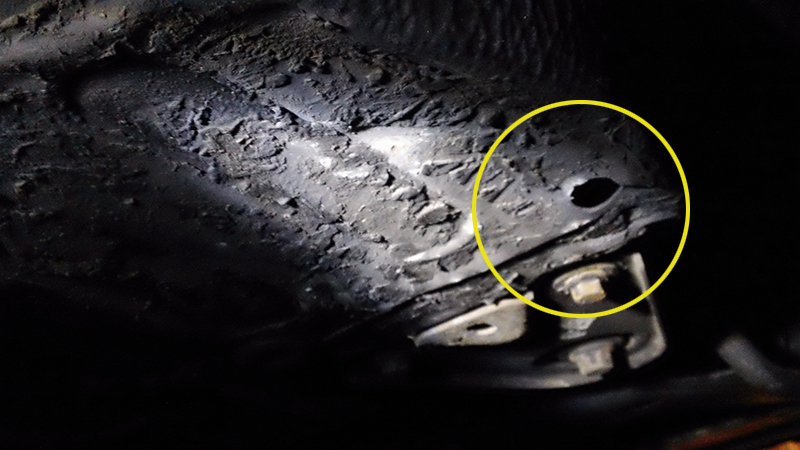 passenger side frame surface with missing round rubber