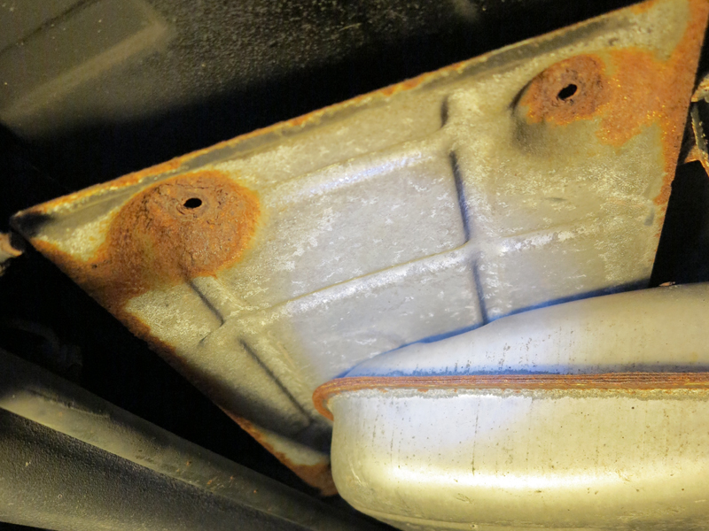 loose plate above the muffler...