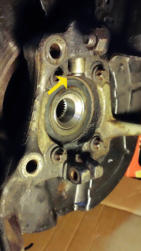 passenger side hub assembly - arrow points to ABS Sensor