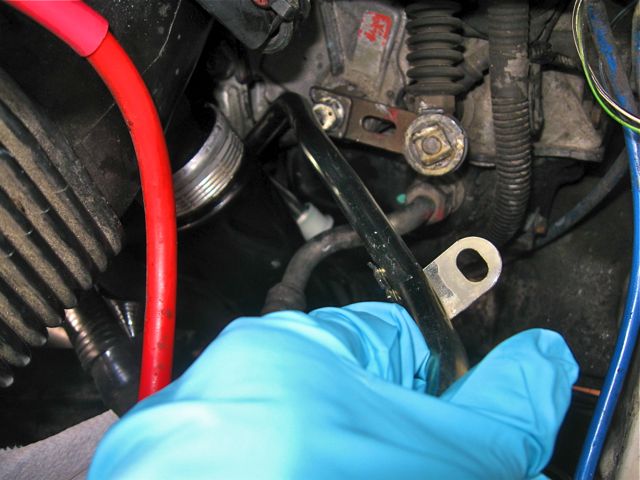 Snaking in the new hose.  The starting orientation and sequence of turns seemed critical.  You can practice on the old hose a time or two until you get it right.  The new hose goes in almost the same way.