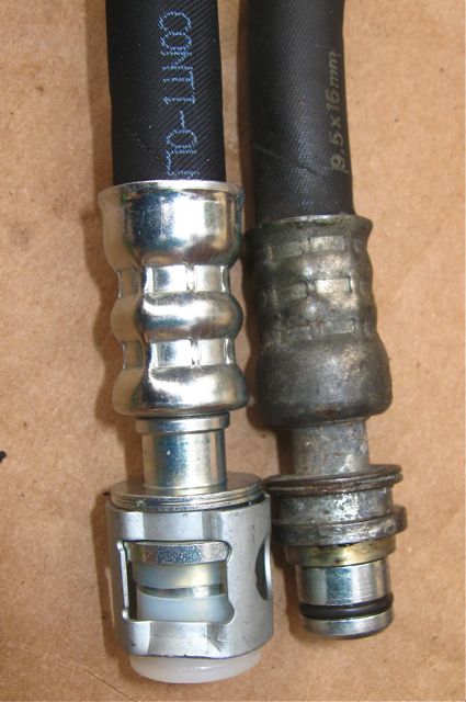 New hose (left) and old hose (right) side by side.  Both have a transparent plastic spacer.