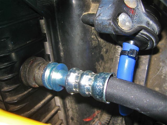 Upper hose inserted into radiator.