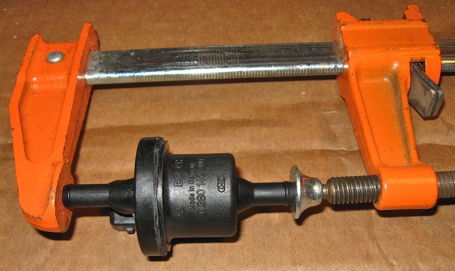 Firm pressure applied with a vise during silicone curing