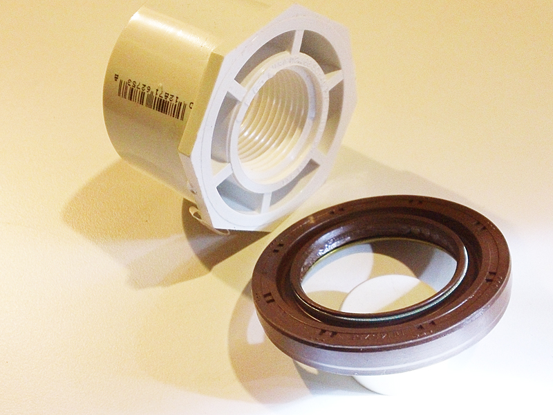 driveaxle seal - view facing transmission, and PVC coupling to aid the install