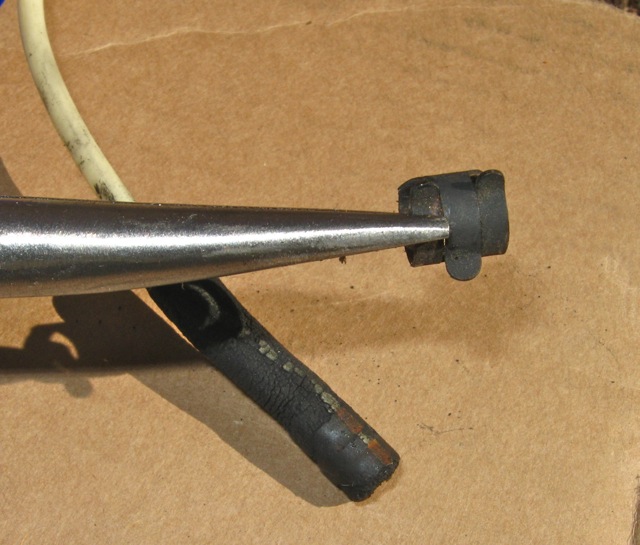 Metal clamp after removing with long needle nose pliers